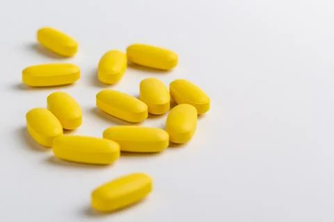 Yellow pills Stock Photos