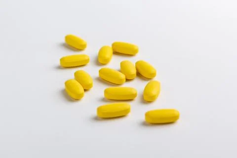 Yellow pills Stock Photos