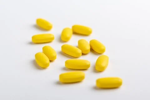 Yellow pills Stock Photos