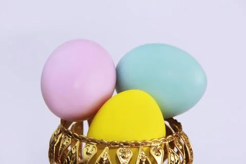 Yellow, pink, blue easter eggs Stock Photos
