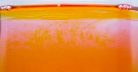 Yellow pink red motion background ink flow in water abstract Video stock 219240207