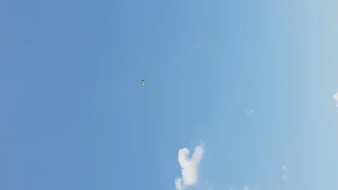 Yellow plane does dangerous stunts in the sky 스톡 동영상 109547667