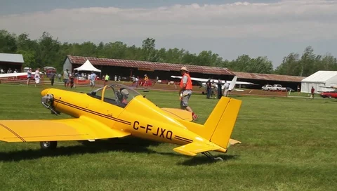 Yellow plane leaving a small plane show Video stock 85940321