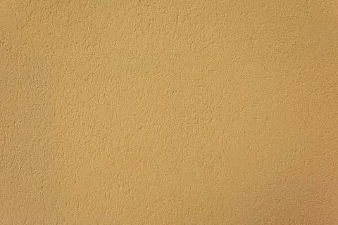 Yellow plaster texture Stock Photos