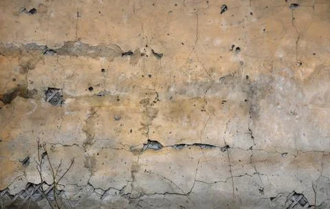 Yellow plastered wall. Texture with plaster stains Stock Photos