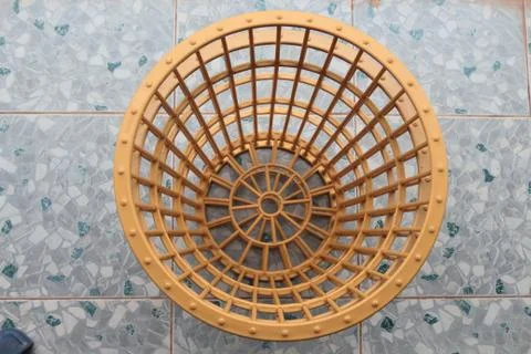 Yellow plastic basket. 스톡 사진