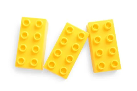 Yellow plastic building blocks on white background Stock Photos