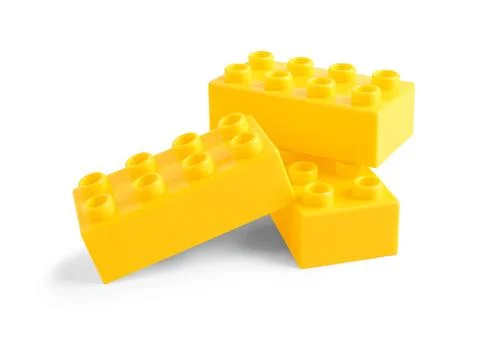 Yellow plastic building blocks on white background Stock Photos
