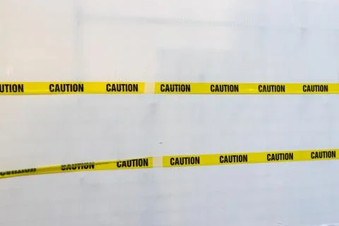 Yellow Plastic Caution Tape Stock Photos