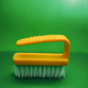 Yellow plastic clothes brush Stock Photos