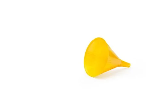 A yellow plastic funnel on a white background with copy space Stock Photos