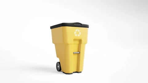 Yellow plastic garbage bin with recycling logo, isolated on white background. 動画素材 96082375