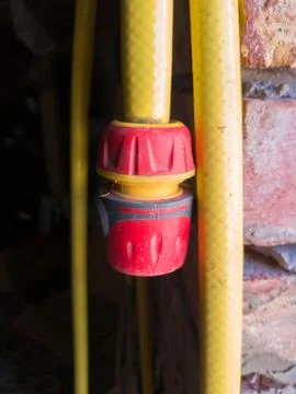 Yellow plastic pipe with fitting Stock Photos