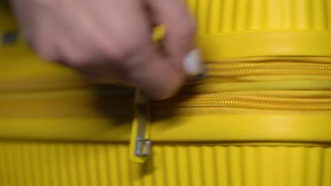 Yellow plastic suitcase. Baggage or hand luggage bag. Open or close with zipper. Stock Footage 171091468