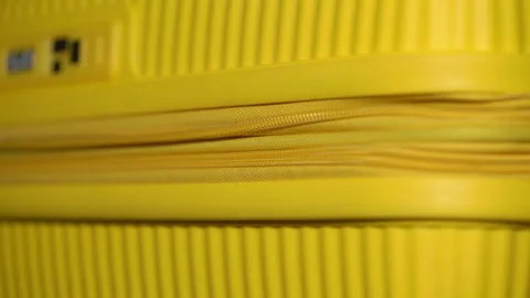 Yellow plastic suitcase. Baggage or hand luggage bag. Open or close with zipper. Stock Footage 175997319