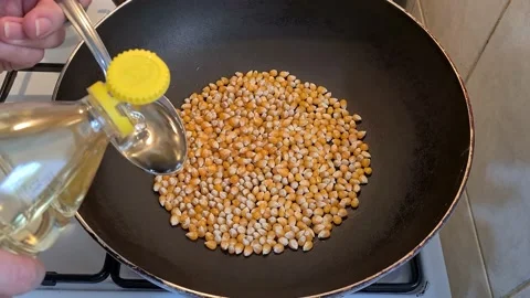 Yellow Popcorn Seeds Frying In Cooking Pan Stock Footage 157443482