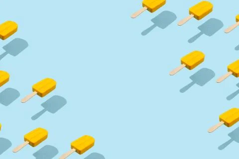 Yellow popsicles border frame on abstract blue background Stock Photos