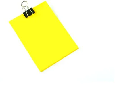 Yellow post it note attached to a board, with  push pin Stock Photos