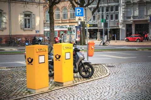 Yellow post office boxes in the city center of Freiburg im Breisgau Stock Photos