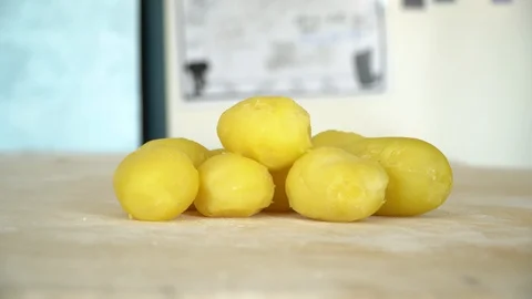 Yellow potatoes side view on a table Stockbeeldmateriaal 128987531
