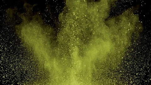 Yellow powder exploding on black background in super slow motion, shot with Video stock 84300027