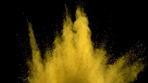 Yellow powder explosion. Slow motion of dust remains engulfing screen Stock Footage 122492559