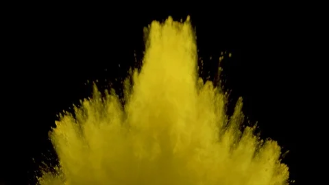 Yellow powder explosion. Slow motion of dust remains engulfing screen Stock Footage 122495544
