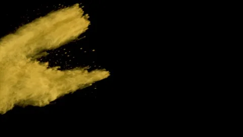 Yellow powder explosion .Slow motion with acceleration from left of screen. Vidéo 122510897