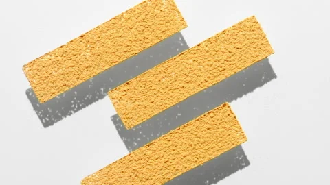 Yellow powder stripes on transparent surface with shadows Stock Footage 343045147