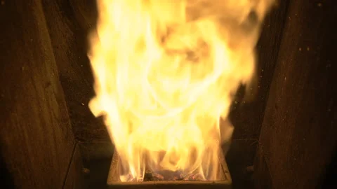 Yellow powerful flames inside the pellet stove, ecological biofuel for heating Stock Footage 130233180