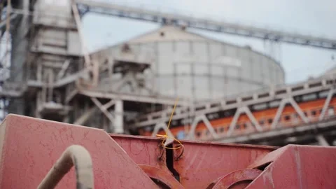 Yellow protective lead seal installed to safely lock cargo holds with wheat on 스톡 동영상 197015137