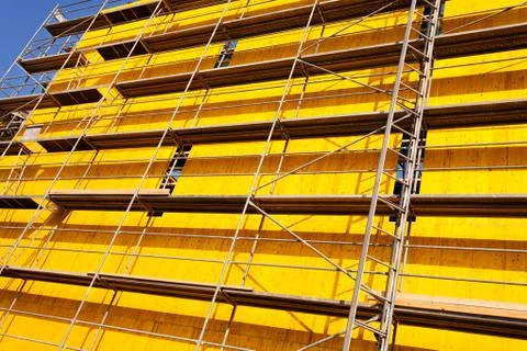 Yellow protective tarpaulins Stock Photos