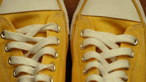 Yellow pump sneakers with laces Stock Footage 311538431