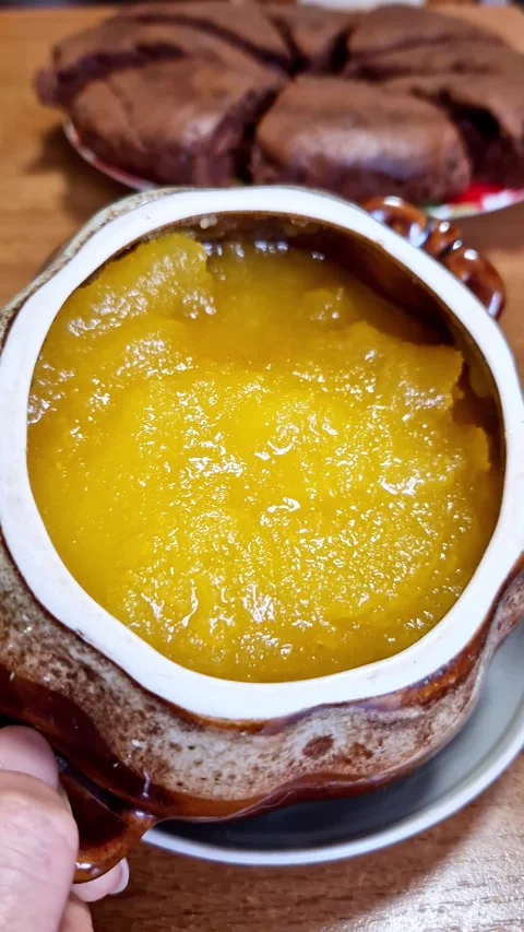 Yellow Pumpkin Puree in a Rustic Ceramic Pot Stock Footage 321964884