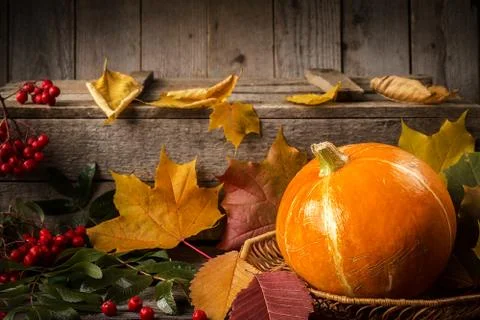 Yellow pumpkin on rustic kitchen table Stock Photos