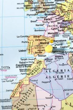 Yellow push pins on world map Stock Photos