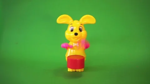 Yellow rabbit doll beats drum Stock Footage 102694312