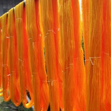 Yellow raw silk thread Stock Photos