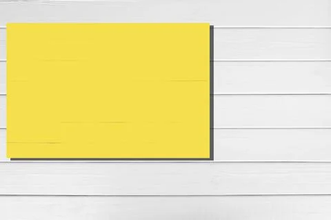 Yellow rectangle space on white horizontal wooden planks, rustic,copy space Stock Photos