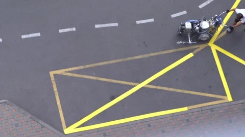 Yellow rectangular sign prohibiting parking on asphalt. Workers apply road Video stock 315492388