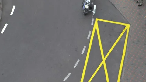 Yellow rectangular sign prohibiting parking on asphalt. Workers apply road Stock Footage 317602787
