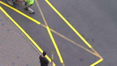 Yellow rectangular sign prohibiting parking on asphalt. Workers apply road Video stock 318512663