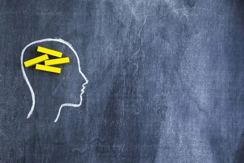 Yellow rectangular wooden box drawn face outline with chalk blackboard. Hi... Stockfoto's