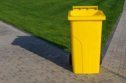 Yellow recycling container Stock Photos