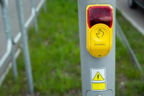 Yellow-red traffic light button touch and wait, Polish language Stock Photos