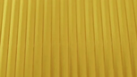 Yellow ribbed paper close-up. Macro shooting of cardboard textured background Stock Footage 169236868