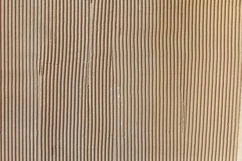 Yellow ribbed texture of the concrete wall. Stock Photos