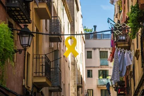 Yellow ribbon, used for independence and political prisoners, in Gothic Quarter. Stock Photos