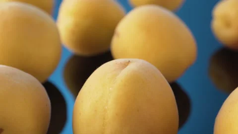 Yellow ripe apricots close-up. Studio video Видео 133452237