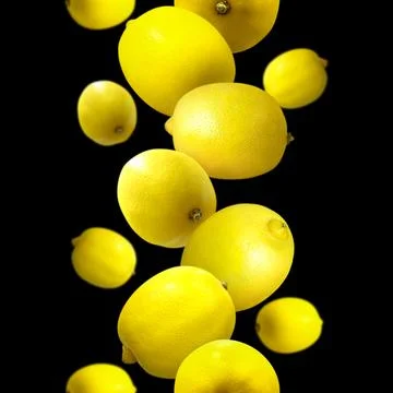 Yellow ripe lemons scattered. pattern, module. close-up, black background. .. Stock Photos